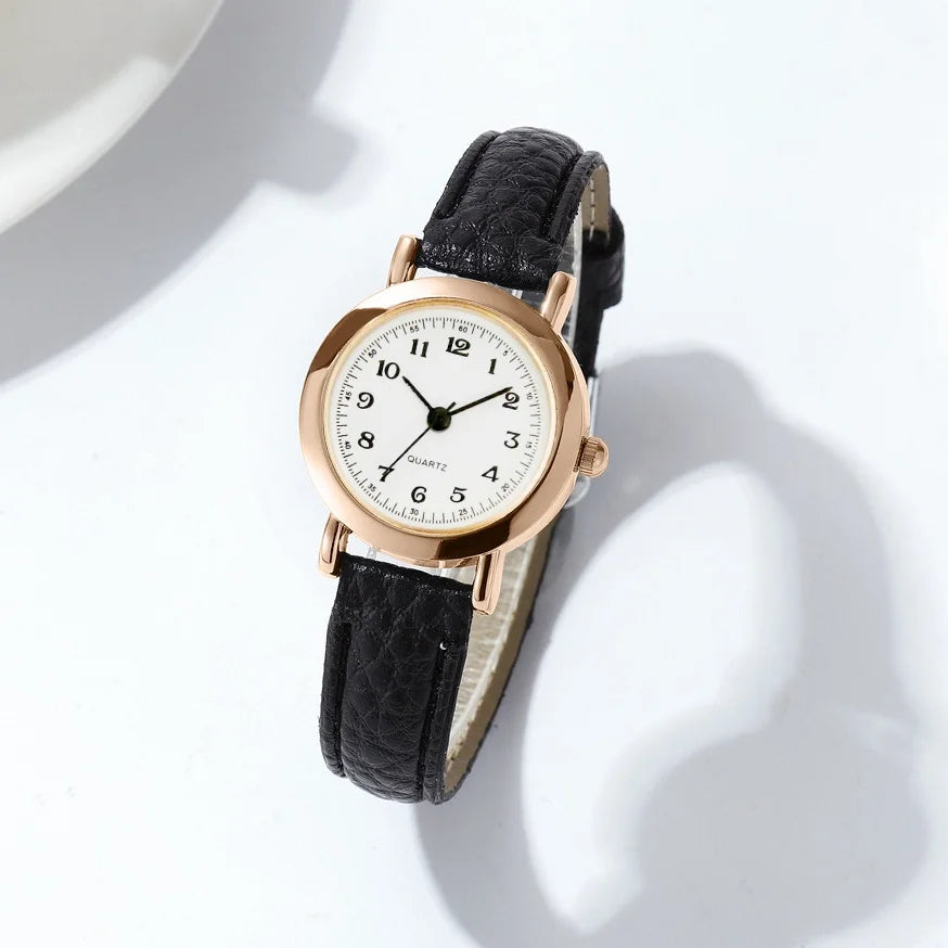 Elegant small watche with a leather strap