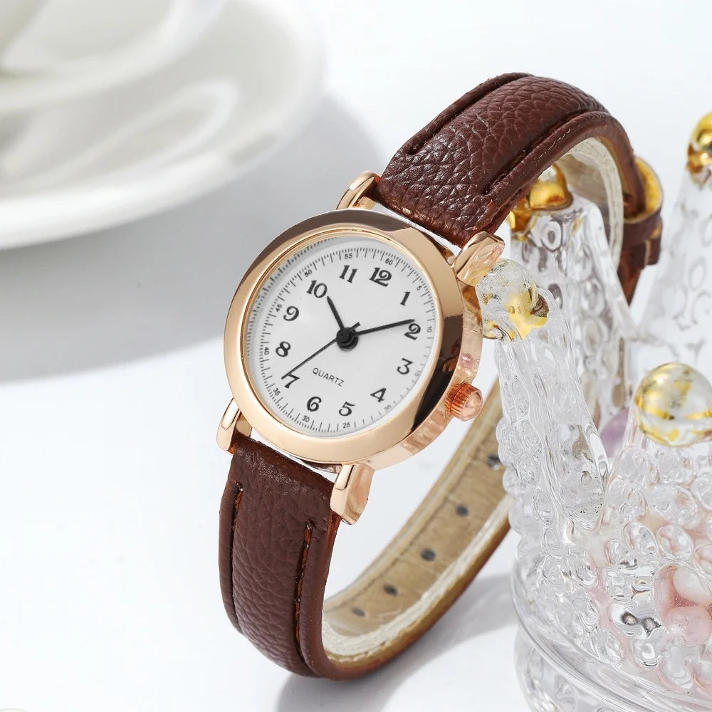 Elegant small watche with a leather strap