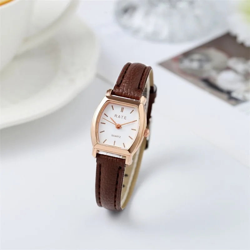Elegant small watche with a leather strap